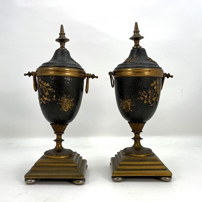 Lot 172 - A pair of Japanese brass and hammered metal...