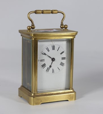 Lot 173 - A lacquered brass carriage clock, having a...