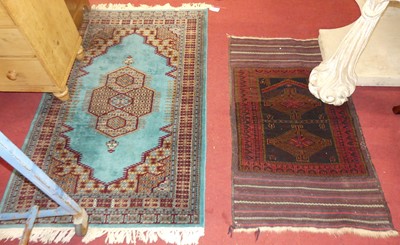 Lot 1165 - A Turkish woollen turquoise ground Oushak rug,...