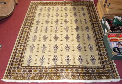 Lot 1167 - A cream ground woollen Turkeman rug, having...