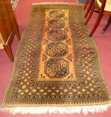 Lot 1170 - A Persian woollen rust ground Bokhara rug,...