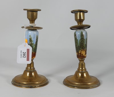 Lot 202 - A pair of brass mounted porcelain table...