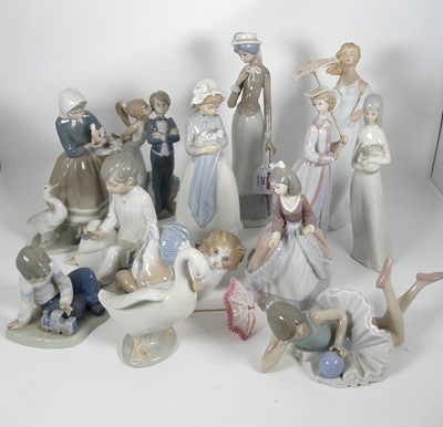 Lot 209 - A collection of porcelain figures to include a...