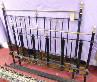 Lot 1187 - A late Victorian black painted iron and brass...