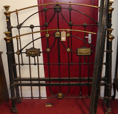 Lot 1189 - A late Victorian black painted iron and brass...