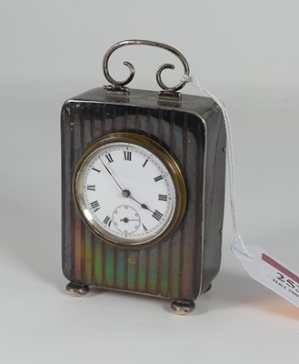 Lot 253 - A George V silver cased mantel clock, the...