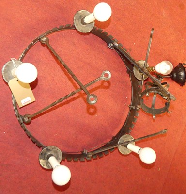 Lot 1035 - A wrought iron five-light ceiling pendant,...