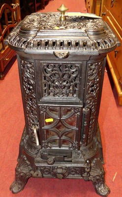 Lot 1232 - A black painted, pierced and floral cast metal...