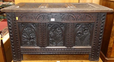 Lot 1235 - A joined and heavily relief carved oak three...