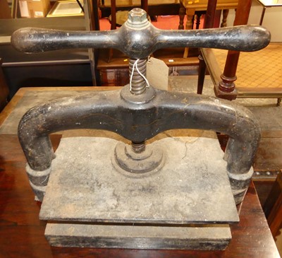 Lot 1259 - A circa 1900 black painted cast iron bookpress,...