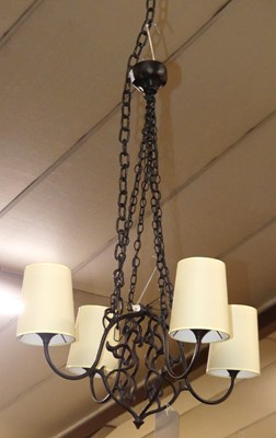 Lot 1276 - A contemporary wrought metal four branch...