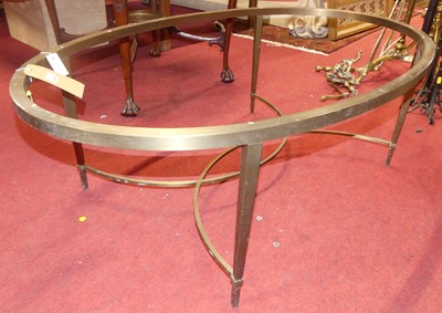 Lot 1293 - A contemporary brushed brass oval coffee table,...