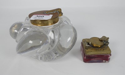 Lot 360 - A glass and brass inkwell of gadrooned form,...