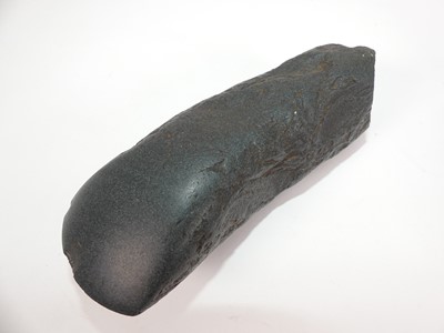 Lot 365 - A carved stone axehead? length 12cm