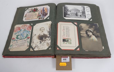 Lot 408 - An Edwardian postcard album and contents, to...