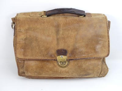 Lot 424 - A leather satchel containing a collection of...