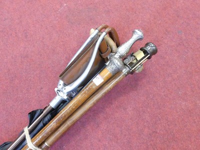 Lot 447 - A collection of seven various walking sticks,...