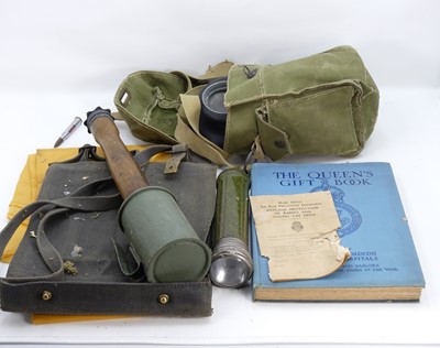 Lot 457 - A collection of militaria to include a gas...