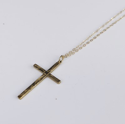 Lot 287 - A 9ct gold cross pendant on finelink neck...