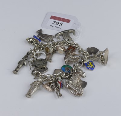 Lot 295 - A silver charm bracelet, containing numerous...