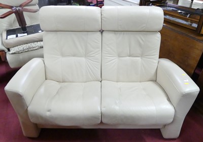 Lot 1328 - A contemporary cream leather upholstered...