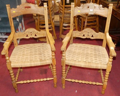 Lot 1338 - A pair of pine and interlaced rush seat elbow...