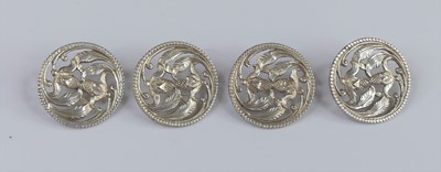 Lot 298 - A matched set of four Edwardian silver buttons,...