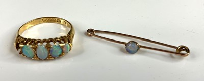 Lot 310 - An 18ct gold opal set half-hoop ring (one...