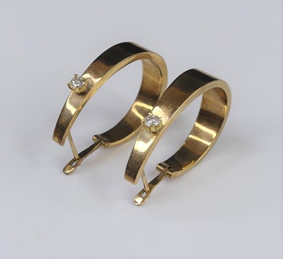 Lot 317 - A pair of modern 9ct gold and diamond set hoop...