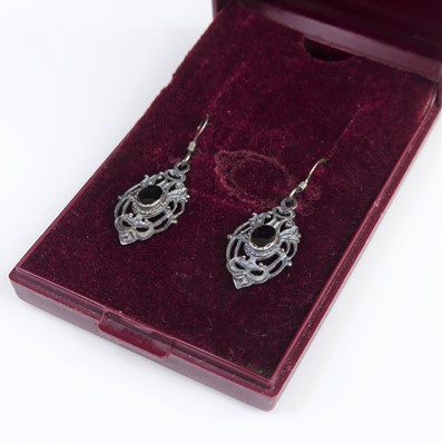 Lot 324 - A pair of modern white metal and black onyx...