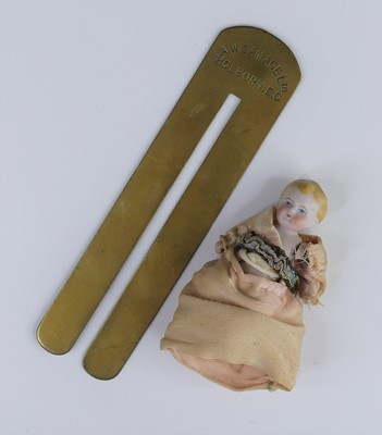 Lot 343 - A brass button stick by A.W. Gamage Ltd of...