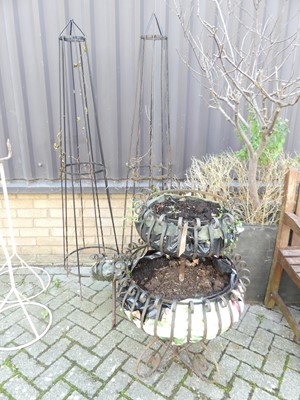 Lot 1405 - A wrought iron three-tier graduated planter,...