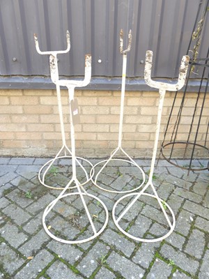 Lot 1406 - A set of four white painted wrought iron twin...