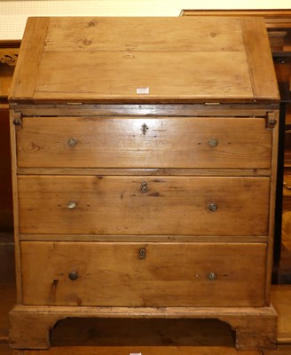 Lot 1375 - A rustic stained pine slope front three drawer...