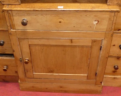 Lot 1376 - A rustic stained pine breakfront side cupboard,...