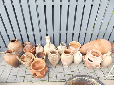 Lot 1419 - A collection of various terracotta garden urns...