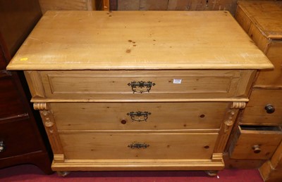 Lot 1378 - A French provincial pine chest of three long...