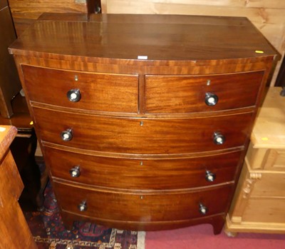 Lot 1380 - A Regency mahogany bow front chest of two...