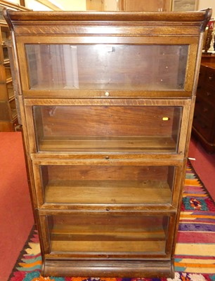 Lot 1386 - A 1930s oak Globe Wernicke four-tier graduated...