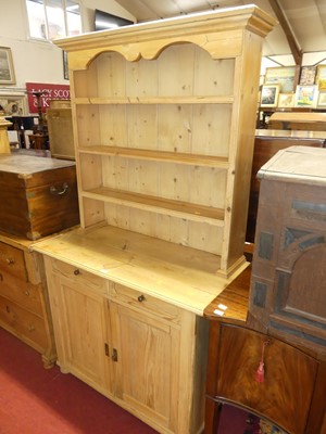 Lot 1389 - A rustic pine kitchen dresser, having...