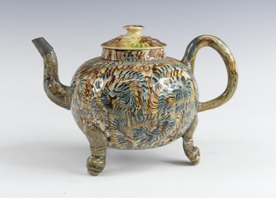 Lot 2069 - A Staffordshire agateware teapot, circa 1755,...