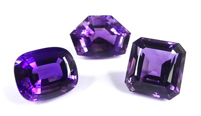 Lot 2568 - Three loose faceted amethyst gemstones, to...