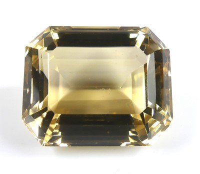 Lot 2569 - A loose rectangular faceted citrine, measuring...