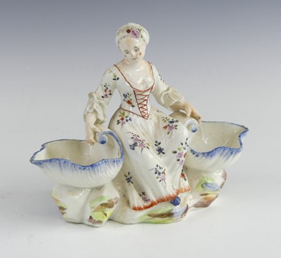 Lot 2124 - A Mennecy porcelain figural double salt,...