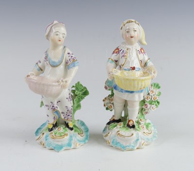 Lot 2112 - A pair of Derby porcelain figural table salts,...