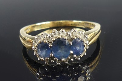 Lot 2699 - A 9ct yellow and white gold, sapphire and...