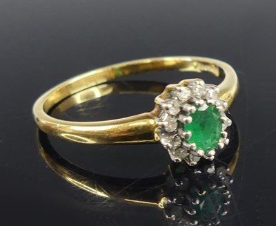 Lot 2717 - An 18ct yellow and white gold, emerald and...