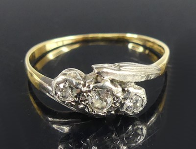 Lot 2718 - A yellow and white metal diamond three-stone...