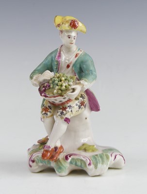 Lot 2114 - A Derby porcelain figure of a grape seller,...