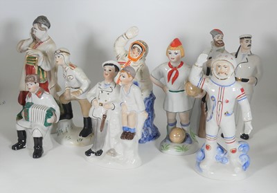 Lot 143 - A collection of eight Kiev porcelain figures,...